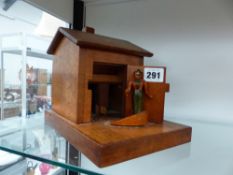 A HAND MADE TREEN CIGARETTE DISPENSER.