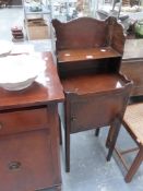 A MAHOGANY BEDSIDE CABINET AND A DRESSING STOOL.