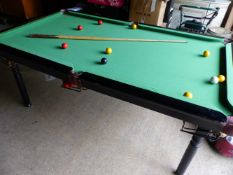 A POOL TABLE.