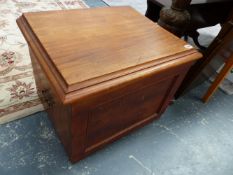 A MAHOGANY OTTOMAN.