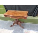 A VICTORIAN WALNUT FOLD OVER CARD TABLE.