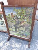 AN OAK FRAMED FIRE SCREEN.