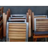 A SET OF EIGHT FOLDING PATIO CHAIRS.