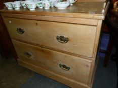 A LATE VICTORIAN PINE CHEST OF TWO DEEP DRAWERS.