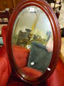 AN EDWARDIAN OVAL WALL MIRROR.