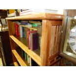 A LARGE HARDWOOD BOOKCASE.