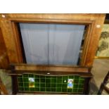 AN OAK FIRE SURROUND AND AN ART NOUVEAU TILED BACK WASHSTAND.