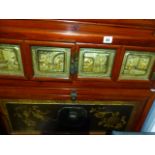 AN UNUSUAL ORIENTAL DECORATED THREE TIER SIDE CABINET.