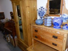 AN EDWARDIAN PINE DRESSING TABLE AND A SIMILAR PINE WARDROBE.