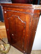 A GEORGIAN OAK AND INLAID CORNER CABINET.