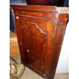 A GEORGIAN OAK AND INLAID CORNER CABINET.