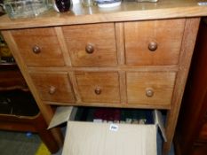 A SMALL LIMED OAK SIX DRAWER CHEST.