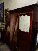 A LARGE ART NOUVEAU WARDROBE.