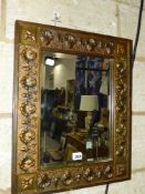 A BRASS FRAMED MIRROR.