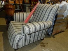 A LARGE DEEP SEAT ARMCHAIR.