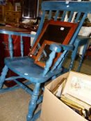 A LARGE SLAT BACK ROCKING CHAIR AND A PAINTED OCCASIONAL TABLE.