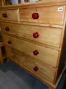 AN ANTIQUE PINE CHEST OF DRAWERS.