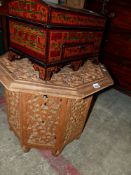 AN EASTERN CARVED HARDWOOD LOW TABLE AND A DECORATED DOME TOP TABLE BOX.