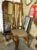 AN ORIENTAL HARDWOOD HIGH BACKED CHAIR.