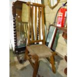 AN ORIENTAL HARDWOOD HIGH BACKED CHAIR.