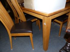 A GOOD QUALITY OAK DINING TABLE AND SIX CHAIRS.