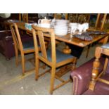 AN ART DECO DRAWER LEAF DINING TABLE AND FOUR CHAIRS.