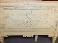 A CARVED AND PAINTED NEO CLASSICAL STYLE DAY BED WITH SWAG DECORATION.