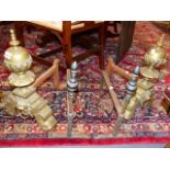 A PAIR OF HEAVY BRASS 17th.C.STYLE ANDIRONS AND A PAIR OF BRONZE MOUNTED IRON FIRE DOGS.