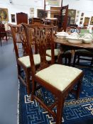 A SET OF SIX GOOD GEORGIAN MAHOGANY DINING CHAIRS WITH SHAPED CREST RAILS ABOVE PIERCED SPLATS.