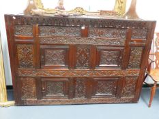 A 17th.C.AND LATER OAK CABINET WITH VARIOUS CARVED PANELS AND FOUR PANEL DOORS. W.177 x H.121cms.