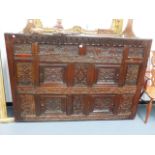 A 17th.C.AND LATER OAK CABINET WITH VARIOUS CARVED PANELS AND FOUR PANEL DOORS. W.177 x H.121cms.