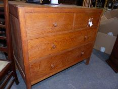 A HEAL'S PALE OAK CHEST OF TWO SHORT AND TWO LONG DRAWERS WITH TURNED KNOB HANDLES.