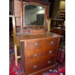 AN OAK ARTS AND CRAFTS DRESSING CHEST IN THE LIBERTY MANNER.