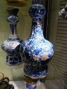 TWO ANTIQUE DELFT BLUE AND WHITE BOTTLE FORM VASES, ONE DECORATED WITH FIGURES IN THE CHINESE TASTE,