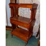AN EARLY 19th.C.MAHOGANY THREE TIER STAND WITH GALLERY BACK, SCROLL AND TURNED SUPPORTS, APRON
