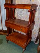 AN EARLY 19th.C.MAHOGANY THREE TIER STAND WITH GALLERY BACK, SCROLL AND TURNED SUPPORTS, APRON