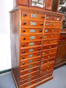 AN ANTIQUE SPECIMEN COLLECTOR'S CHEST OF TWENTY SIX DRAWERS, EACH WITH GLAZED COVER.