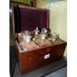 A REGENCY DOME TOP MAHOGANY DECANTER CASE, THE INTERIOR FITTED WITH SIX DECANTERS AND STOPPERS.