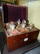 A REGENCY DOME TOP MAHOGANY DECANTER CASE, THE INTERIOR FITTED WITH SIX DECANTERS AND STOPPERS.