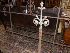 A 19th.C.WROUGHT IRON SIGN FRAME TOGETHER WITH A CAST IRON FLEUR DE LYS ROOF FINIAL. (2)