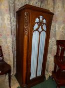 A PAIR OF CONTINENTAL ART DECO CARVED OAK INLAID PIER CABINETS WITH GLAZED DOORS AND FLORAL