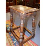 AN OLD ANTIQUE STYLE OAK JOINT STOOL. W.36cms.
