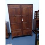 AN ANTIQUE ARTS AND CRAFTS COTSWOLD SCHOOL OAK TWO DOOR WARDROBE. W.122 x H.182.5cms.