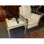 A CARVED FRENCH GILTWOOD LOUIS XVI STYLE GENTLEMAN'S LIBRARY ARMCHAIR AND A GILT DECORATED FAUX