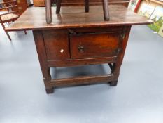 A 16th/17th.C.OAK LOW CUPBOARD WITH PLANK TOP, CHAMFERRED LEGS AND STRETCHER BASE. W.110 x H.71cms.