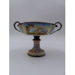 AN ANTIQUE AUSTRIAN ENAMELLED TWIN HANDLE TAZZA WITH FLARED PEDESTAL BASE, FINELY DECORATED WITH