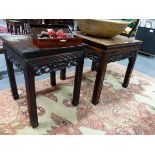 TWO CHINESE CARVED HARDWOOD SQUARE STANDS WITH PIERCED FOLIATE APRONS AND MOULDED STRAIGHT LEGS.