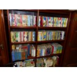 A LARGE COLLECTION OF BOOKS CONTAINING MANY BIGGLES AND RUPERT BEAR VOLUMES TOGETHER WITH BOOKS