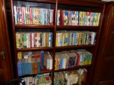 A LARGE COLLECTION OF BOOKS CONTAINING MANY BIGGLES AND RUPERT BEAR VOLUMES TOGETHER WITH BOOKS