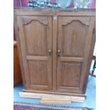 A VICTORIAN PINE KITCHEN CABINET WITH PANELLED DOORS. W.115 x H.147cms.